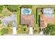 Lovely home featuring a uniquely-shaped pool and fenced backyard at 1901 Paddock Dr, Plant City, FL 33566