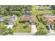 Aerial view of a suburban home showcasing manicured lawns and a spacious driveway at 1901 Paddock Dr, Plant City, FL 33566