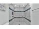 Luxurious bathroom with stylish tile, shower, and glass door at 1901 Paddock Dr, Plant City, FL 33566