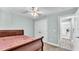 Bedroom with closet, ceiling fan, and access to another room at 1901 Paddock Dr, Plant City, FL 33566