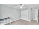 Bedroom with closet, ceiling fan, and access to another room at 1901 Paddock Dr, Plant City, FL 33566