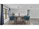 Dining room with gray plank floors, an updated light fixture, and room to entertain Gathering and friends at 1901 Paddock Dr, Plant City, FL 33566