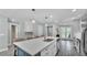 Spacious island with seating, stainless steel appliances, and an open concept design at 1901 Paddock Dr, Plant City, FL 33566