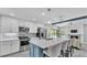 Well-equipped kitchen with modern appliances, breakfast bar seating, and an open design at 1901 Paddock Dr, Plant City, FL 33566