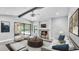 Bright living room with modern fireplace, view of pool, and an open-concept layout at 1901 Paddock Dr, Plant City, FL 33566
