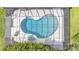Aerial view of a screened-in pool and spa, complemented by a spacious patio for outdoor relaxation at 1901 Paddock Dr, Plant City, FL 33566