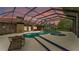 Screened-in pool featuring a spa and surrounding patio, offering a private outdoor space at 1901 Paddock Dr, Plant City, FL 33566