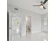 Bedroom with marble floors and access to hallway and bathroom at 1905 E Broad St, Tampa, FL 33610