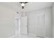Bedroom features ceiling fan, closet and tile floor at 1905 E Broad St, Tampa, FL 33610