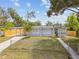 Charming single-story home with a covered carport and a well-maintained front yard and modern gray paint at 1905 E Broad St, Tampa, FL 33610