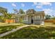 Charming front exterior of this property boasts a well-kept lawn and a welcoming entrance at 1905 E Broad St, Tampa, FL 33610