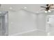 View of the living room with ceiling fan, recessed lighting and tile floors at 1905 E Broad St, Tampa, FL 33610