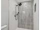 Modern shower with gray tile accent and dual shower head at 1905 E Broad St, Tampa, FL 33610