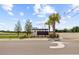 Suncoast Landing community entrance with palm trees and well-manicured landscaping on a sunny day at 191 Brofield St, Brooksville, FL 34604
