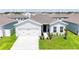 Charming single-story home with a well-manicured lawn, a two-car garage, and classic design elements at 191 Brofield St, Brooksville, FL 34604