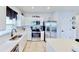 Modern kitchen with stainless steel appliances, white countertops, stylish cabinetry, and tile floors at 191 Brofield St, Brooksville, FL 34604