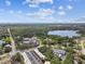 Expansive aerial view of lush landscape, lake, and buildings against a bright, partly cloudy sky at 2003 Greenbriar Blvd # 8, Clearwater, FL 33763