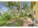 Expansive backyard features mature trees and green space, perfect for outdoor activities at 2003 Greenbriar Blvd # 8, Clearwater, FL 33763