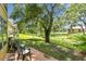 Charming backyard with patio seating and lush greenery offers a relaxing outdoor space at 2003 Greenbriar Blvd # 8, Clearwater, FL 33763