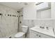 Modern bathroom with marble tile shower, updated fixtures, and a sleek vanity at 2003 Greenbriar Blvd # 8, Clearwater, FL 33763
