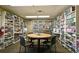 Community library featuring floor-to-ceiling bookshelves and a cozy reading area at 2003 Greenbriar Blvd # 8, Clearwater, FL 33763
