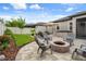 Landscaped backyard with a paver patio, fire pit, and a hot tub at 20108 Stone Pine Cir, Lutz, FL 33558