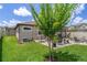 Spacious backyard with a paver patio, fire pit, and mature landscaping at 20108 Stone Pine Cir, Lutz, FL 33558
