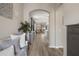 Bright entryway with wood floors and an arched opening leading to an open living space at 20108 Stone Pine Cir, Lutz, FL 33558
