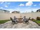 Paver patio features a fire pit surrounded by chairs, perfect for outdoor gatherings at 20108 Stone Pine Cir, Lutz, FL 33558