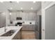 Kitchen with an island, gray cabinets, stainless steel appliances, and subway tile backsplash at 20108 Stone Pine Cir, Lutz, FL 33558