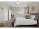 Comfortable main bedroom with a neutral color palette and en suite bathroom at 20108 Stone Pine Cir, Lutz, FL 33558