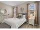 Bright main bedroom with plush bedding and natural light at 20108 Stone Pine Cir, Lutz, FL 33558