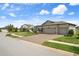 A lovely single-story home with a three-car garage and a brick paver driveway at 20108 Stone Pine Cir, Lutz, FL 33558