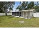 Back of home featuring an enclosed porch at 2044 Balfour Cir, Tampa, FL 33619