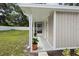 Back of home featuring access to a covered porch and white fence at 2044 Balfour Cir, Tampa, FL 33619