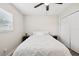Charming bedroom featuring an abundance of natural light, a ceiling fan, and a double closet at 2044 Balfour Cir, Tampa, FL 33619