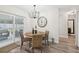 Charming dining area boasts a stylish chandelier and sliding glass doors to the patio at 2044 Balfour Cir, Tampa, FL 33619