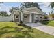 Charming single-story home featuring a cozy front porch and well-manicured lawn at 2044 Balfour Cir, Tampa, FL 33619