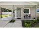 Charming front entrance with seating and manicured landscaping at 2044 Balfour Cir, Tampa, FL 33619