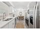 Modern kitchen featuring stainless steel appliances and seamless access to the dining area at 2044 Balfour Cir, Tampa, FL 33619
