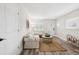 Bright living room features neutral colors, wood floors, and a large window at 2044 Balfour Cir, Tampa, FL 33619