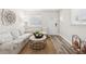 Cozy living room showcasing natural light, wood floors and a comfortable aesthetic at 2044 Balfour Cir, Tampa, FL 33619