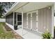 A covered back patio area with screen and storage at 2044 Balfour Cir, Tampa, FL 33619