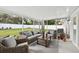 View of screened patio with outdoor furniture and garden decor at 2044 Balfour Cir, Tampa, FL 33619