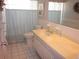 Bathroom with a wide mirror, neutral tile, and vanity at 2143 Wrens Way, Clearwater, FL 33764