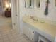 Bathroom featuring a sink vanity and white tiled flooring at 2143 Wrens Way, Clearwater, FL 33764