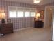 Spacious bedroom featuring carpet floors and a view to the bathroom at 2143 Wrens Way, Clearwater, FL 33764