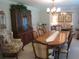 Spacious dining room featuring a large wooden table and chairs, perfect for Gathering gatherings and entertaining at 2143 Wrens Way, Clearwater, FL 33764