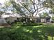 Charming single-story home with well-manicured lawn and mature shade tree at 2143 Wrens Way, Clearwater, FL 33764
