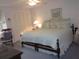 Tranquil bedroom with comfortable bedding and soft accents at 2143 Wrens Way, Clearwater, FL 33764